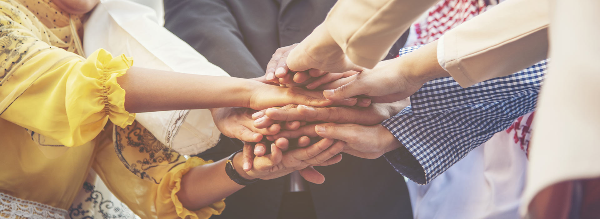 people putting their hands together